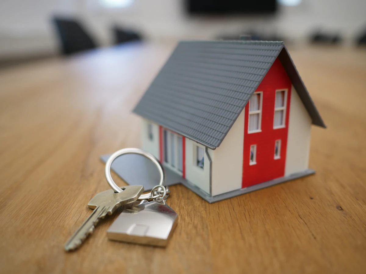 Small model house on a wooden table