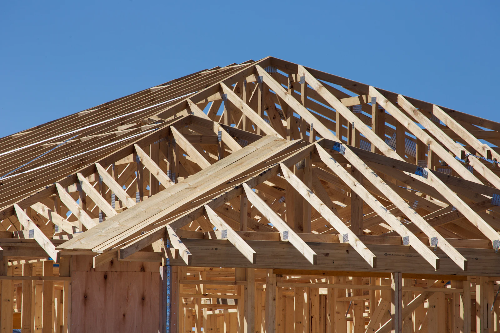 A new house under construction with timber framing