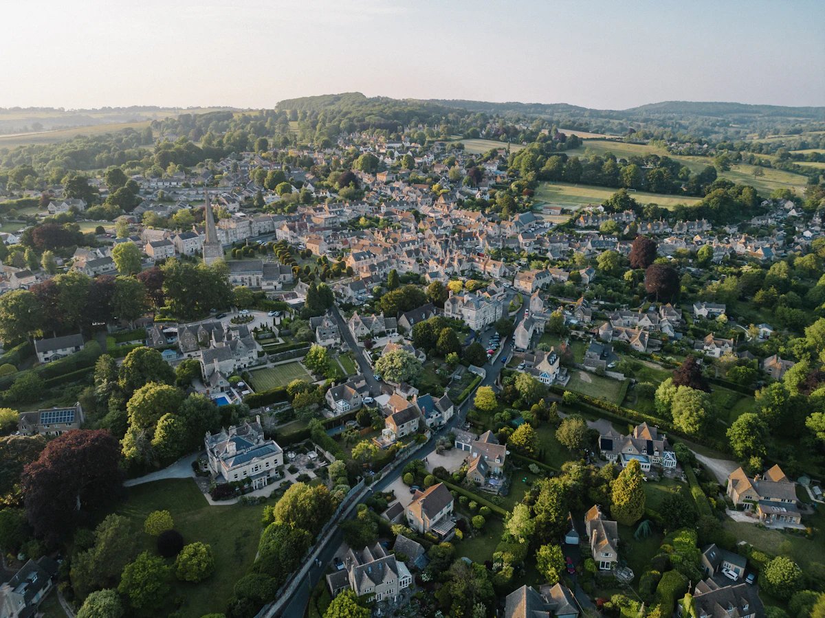 Aerial view of a small town surrounded by trees